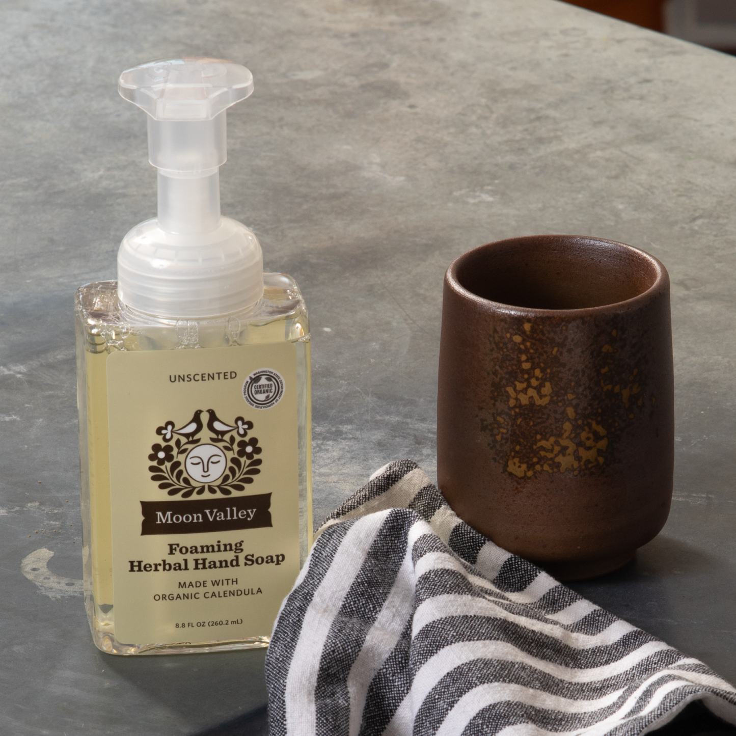 Moon Valley Organics Foaming Herbal Hand Soap Front Dispenser Bottle Unscented on a kitchen countertop