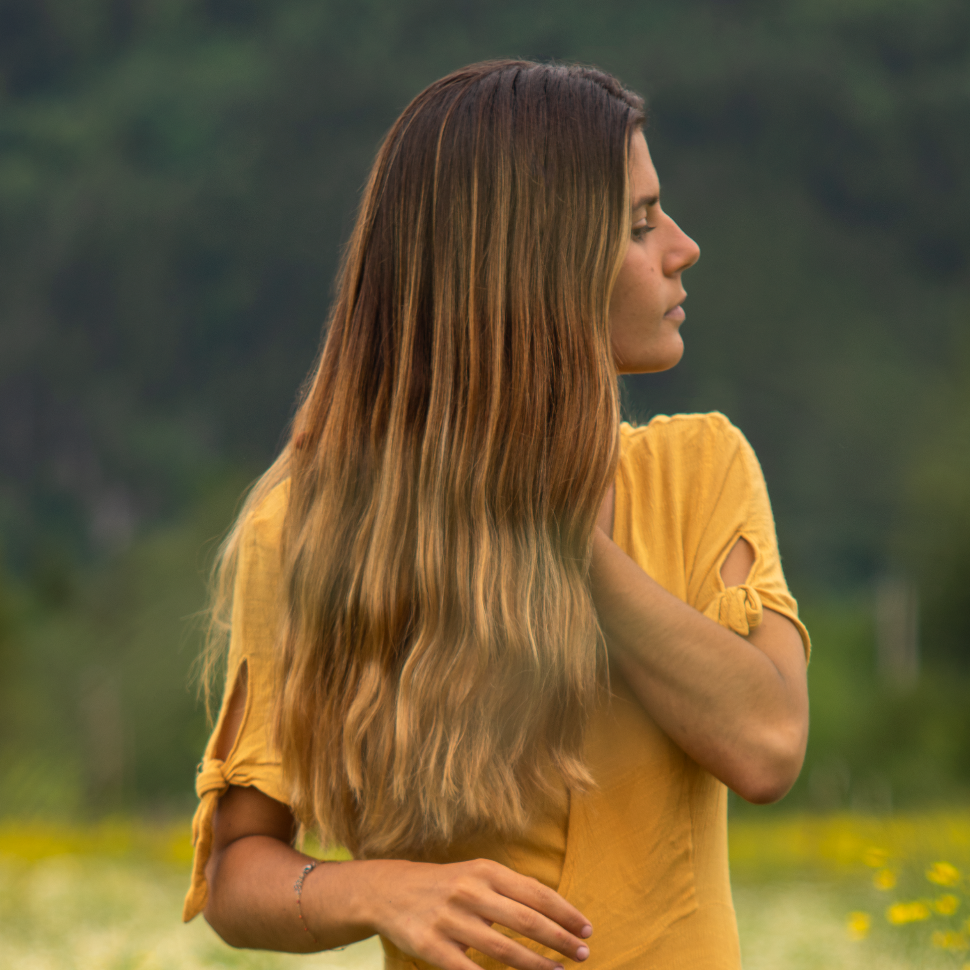 Moon Valley Organics Hair Therapy Every Type Woman brushing elegant hair