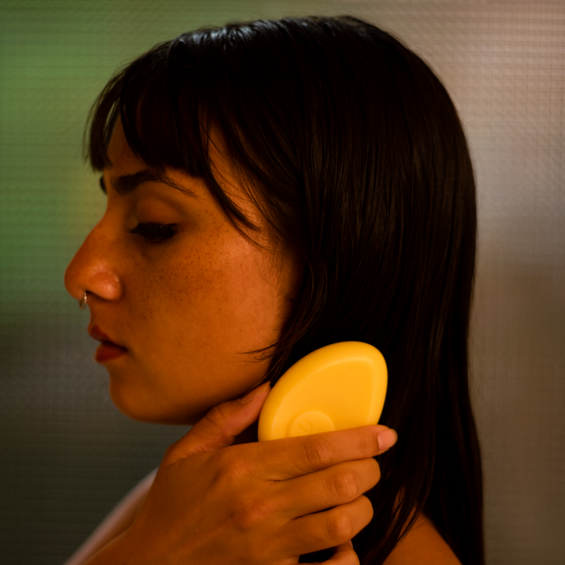 Moon Valley Organics Conditioner Bar Sweet Carrot Being Applied to Womans Hair