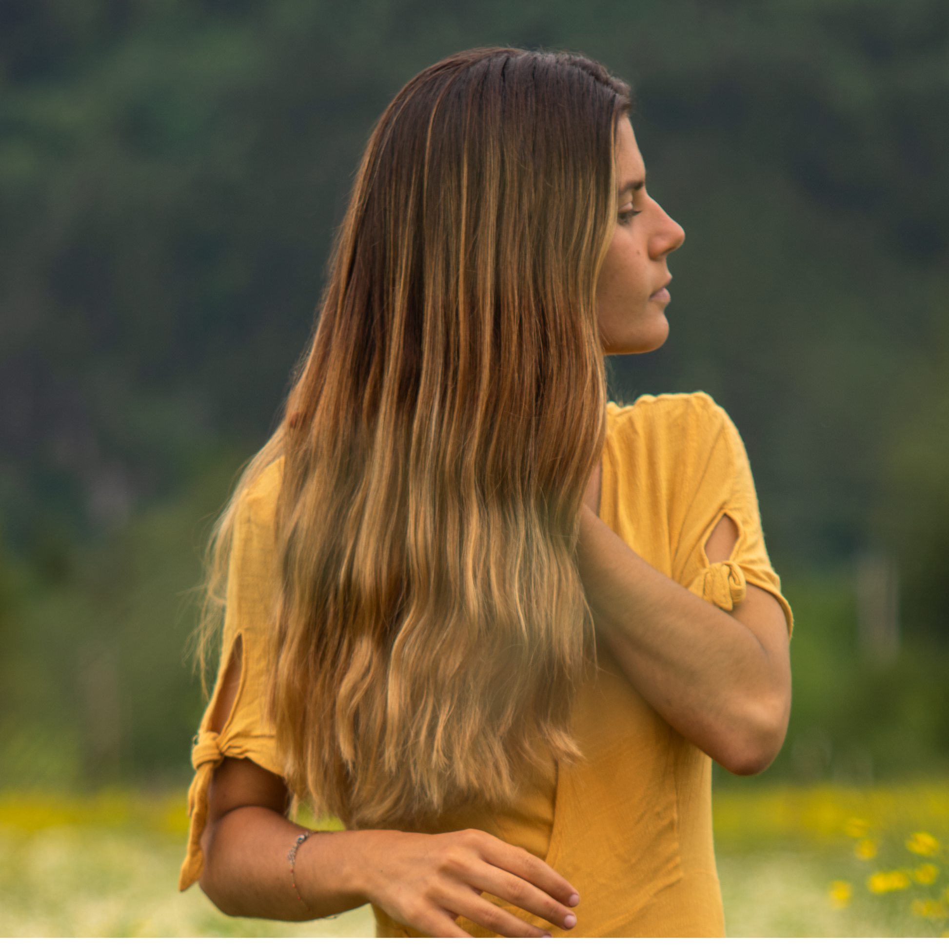 Moon Valley Organics Hair Therapy Every Type Woman brushing lush defined healthy hair